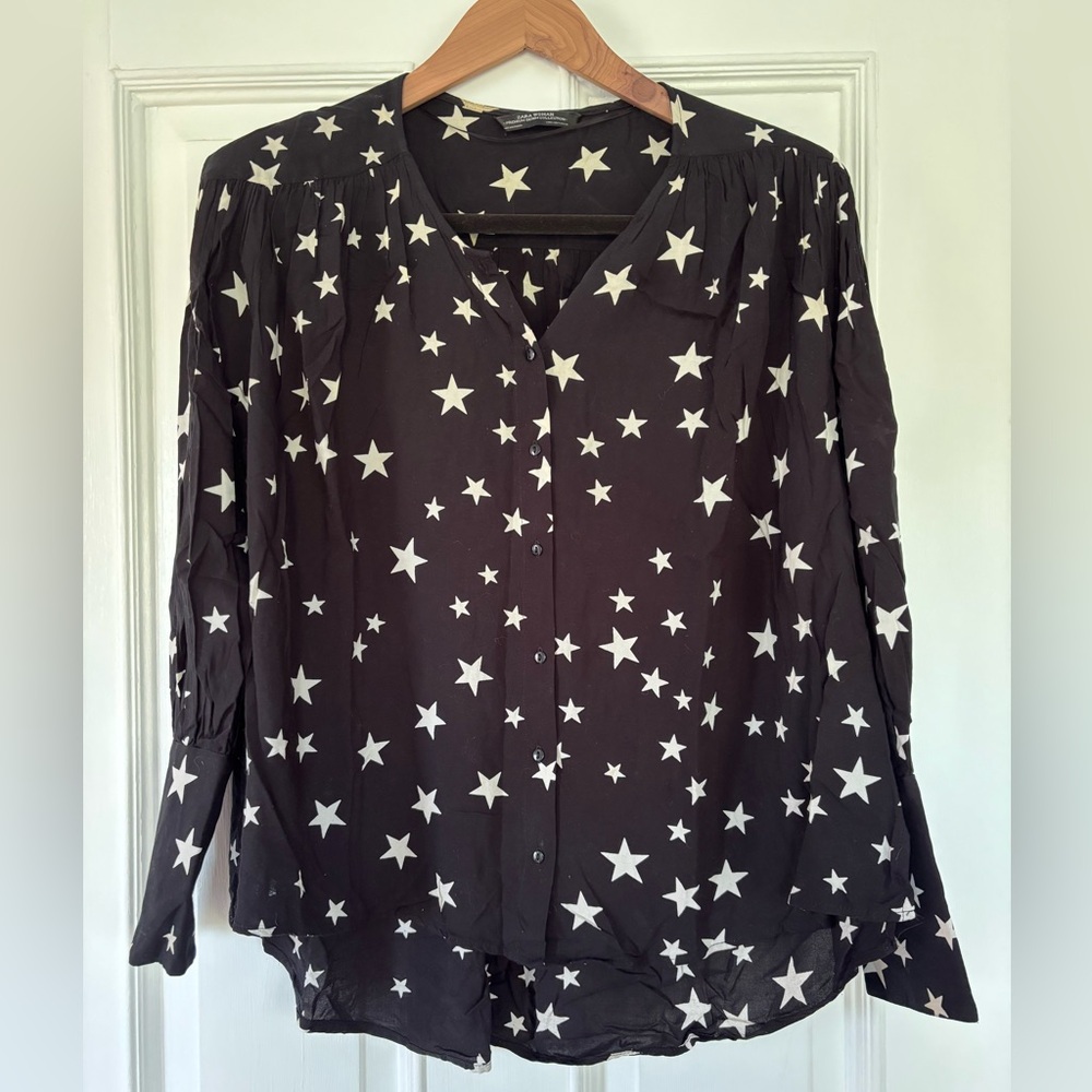 Batwing star blouse with elongated skinny cuffs